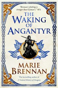 A book cover featuring the words "The Waking of Angantyr" in blue letters, and the author's name "Marie Brennan" in red letters. An illustrated person holding a sword is in the center of the image.