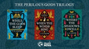 Three book covers presented on a teal background. The first cover features the words "While the Gods Sleep" by "L.D. Colter." The cover background is light teal. Greek images in gold and black pottery are in the center. The second cover is "When the Winds Sing" by "L.D. Colter." The background is red with black and gold geometrical patterns. The third image features the text "Where the Shadows Dwell" by "L.D. Colter." The background is dark green-teal with stylized images in gold and pink.
