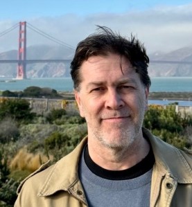 Head shot photo of Eric Scot Tryon with Golden Gate Bridge in the background.
