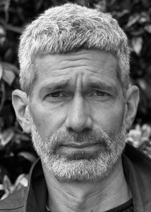 A man with short light hair and neat beard.